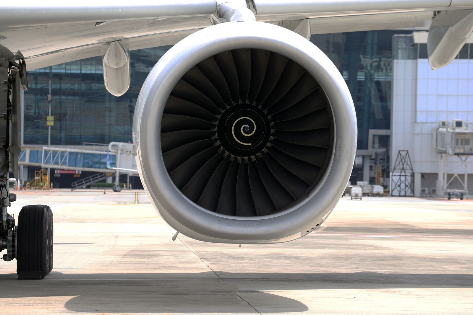 A commercial aircraft engine on the runway