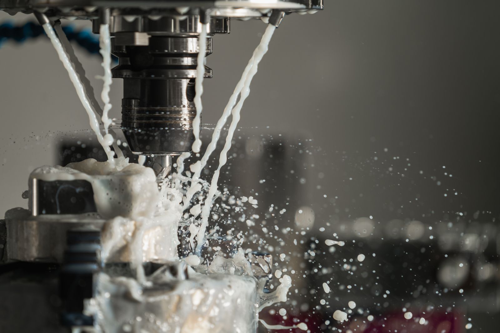A CNC machine cutting metal with coolant