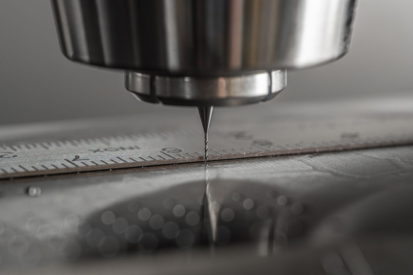 A CNC milling machine cuts metal