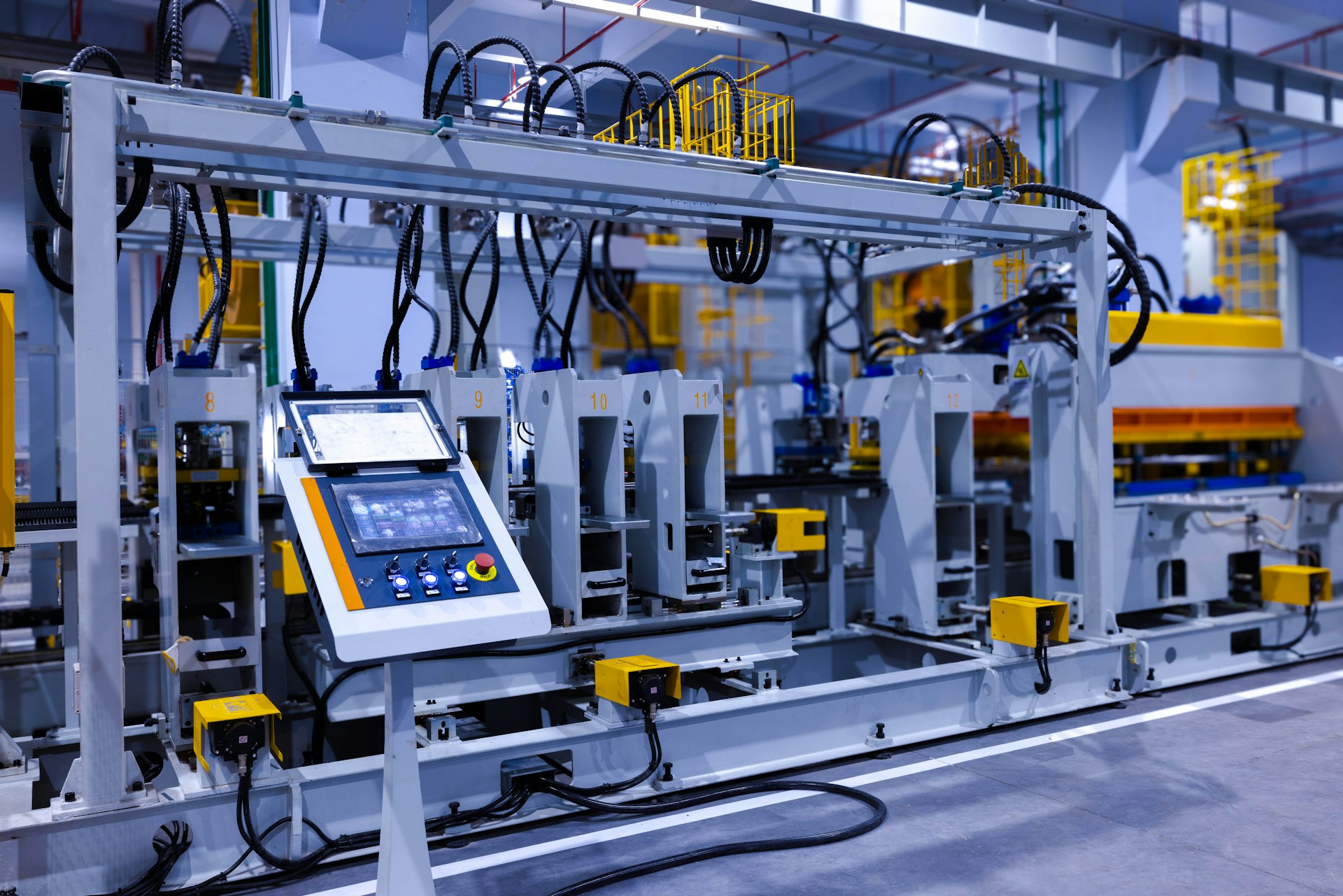 The operator panel of an automated press line on a modern manufacturing floor