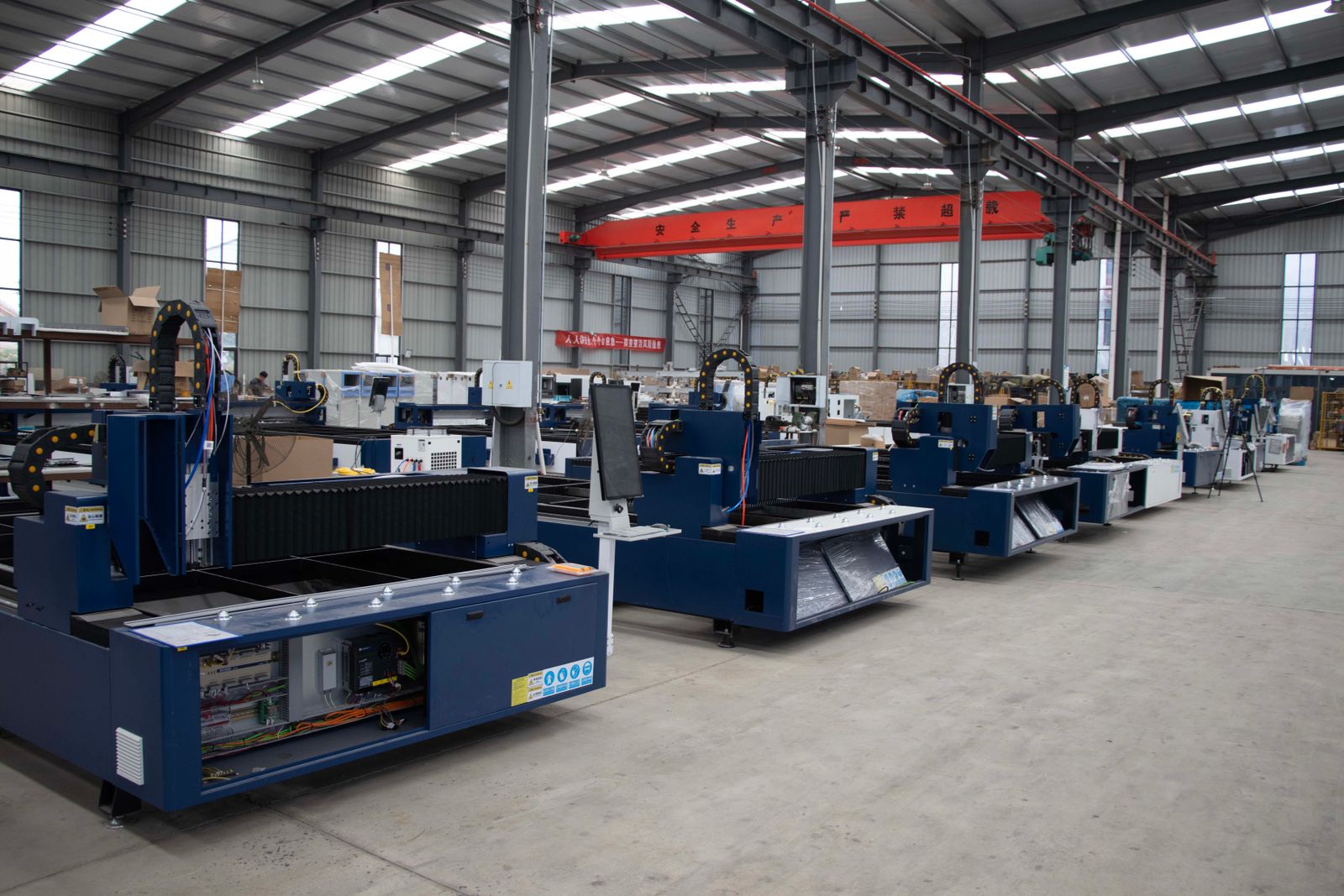 A row of CNC machines in a plant