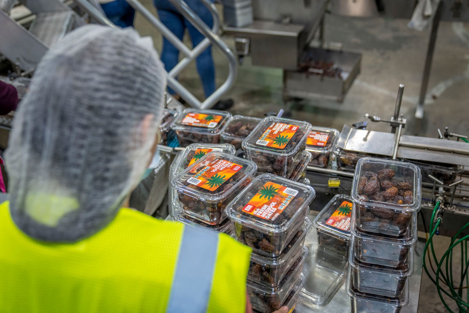 A worker packages product in a modern food facility