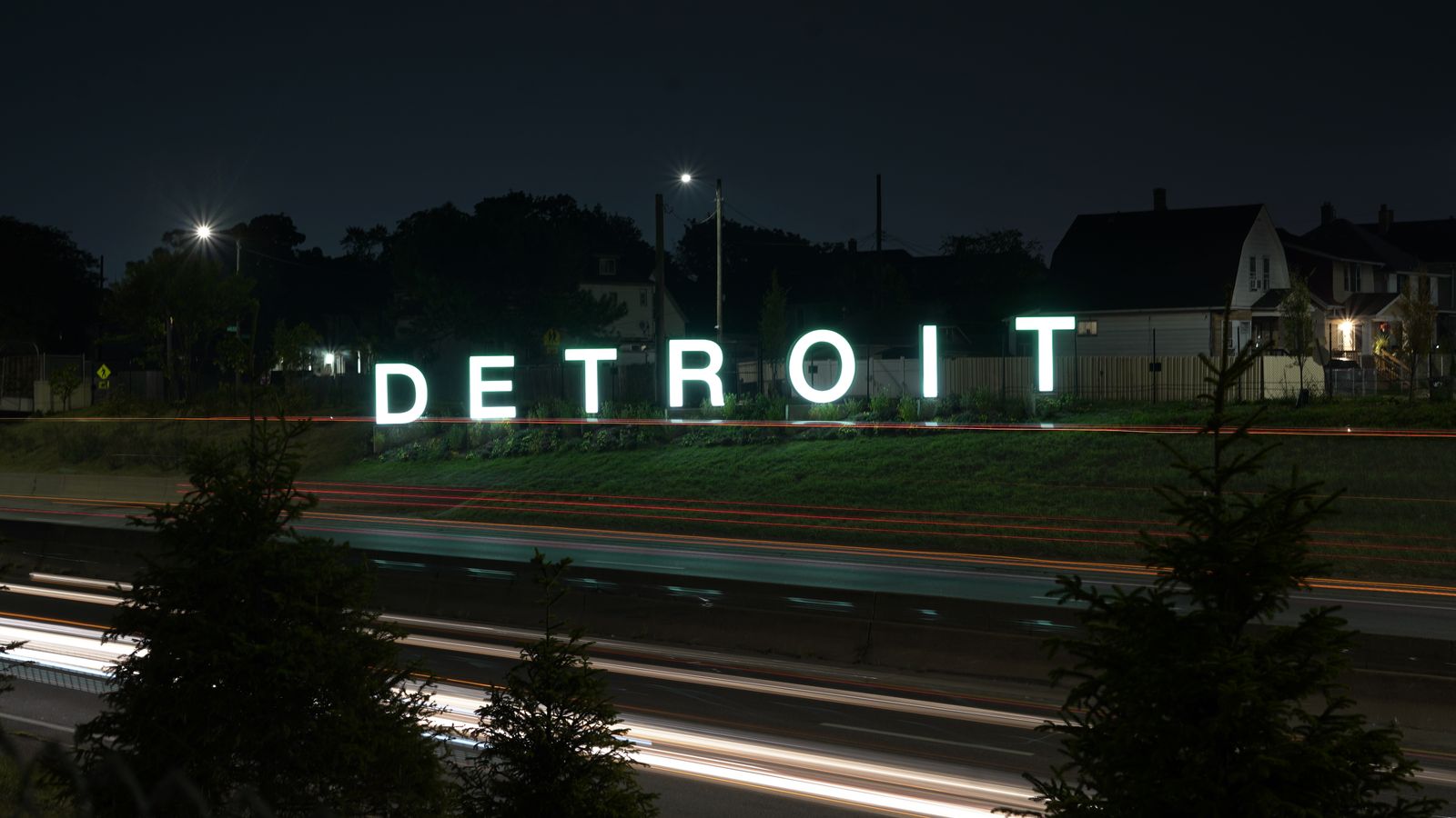 The illuminated Detroit sign at night