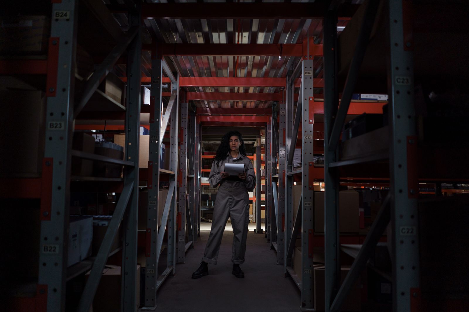 A warehouse worker among industrial shelves